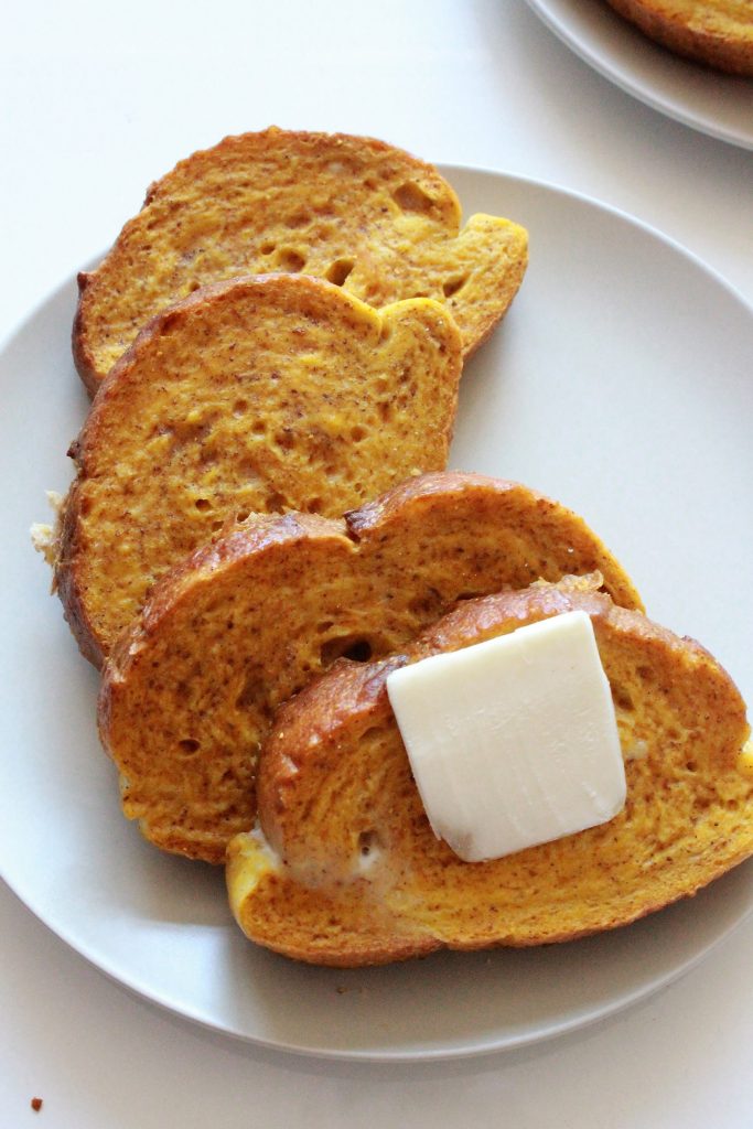 Dairy Free Pumpkin French Toast - This fall-inspired Pumpkin French Toast is made with real pumpkin, no added sugar, and is completely addictive. Bonus: It can be made in an oven to ensure even cooking, easy clean up, and cut down on time! #pumpkinfrenchtoast #frenchtoast #pumpkinrecipes #dairyfree #fallrecipes