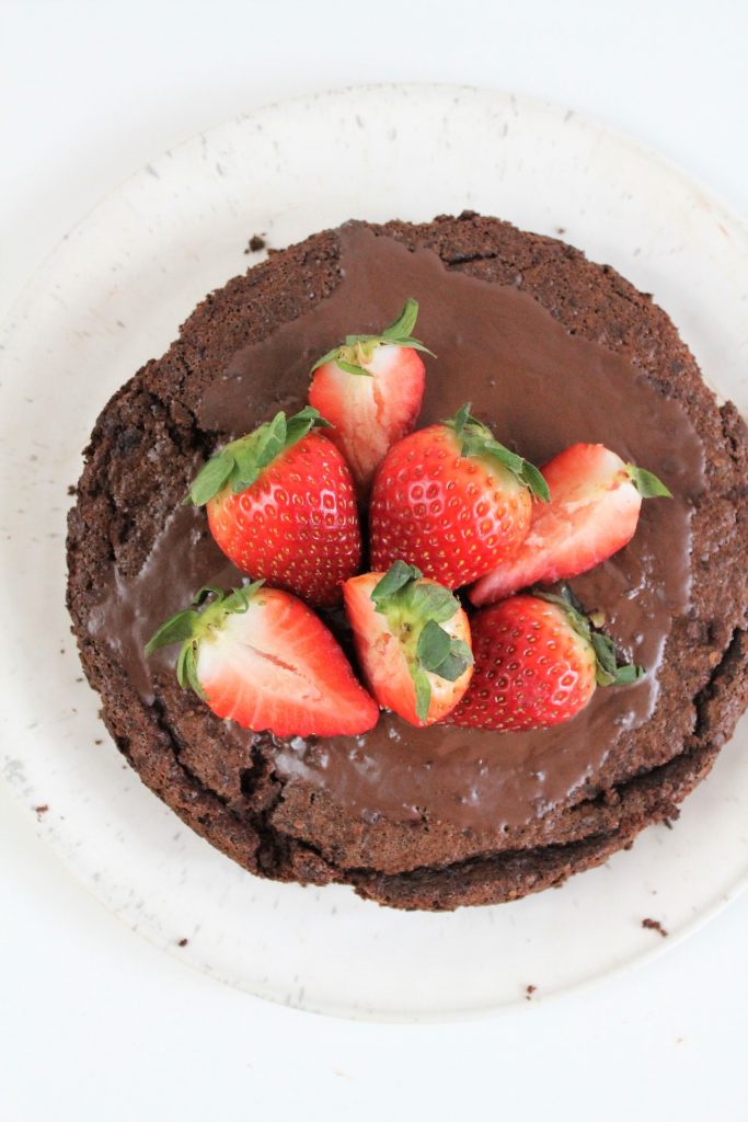 gluten free flourless chocolate cake with strawberries on top