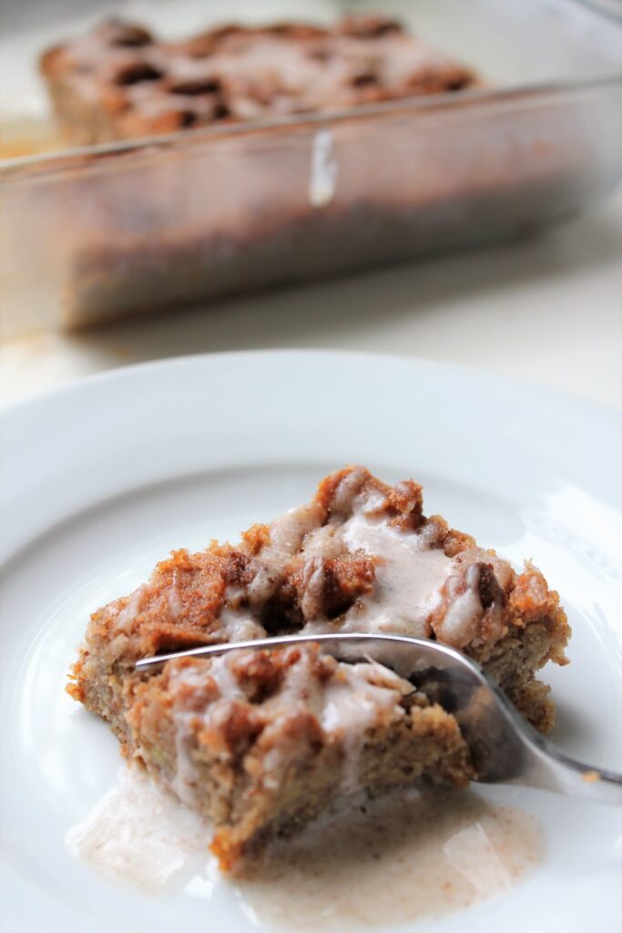 A fork slicing into a coffee cake