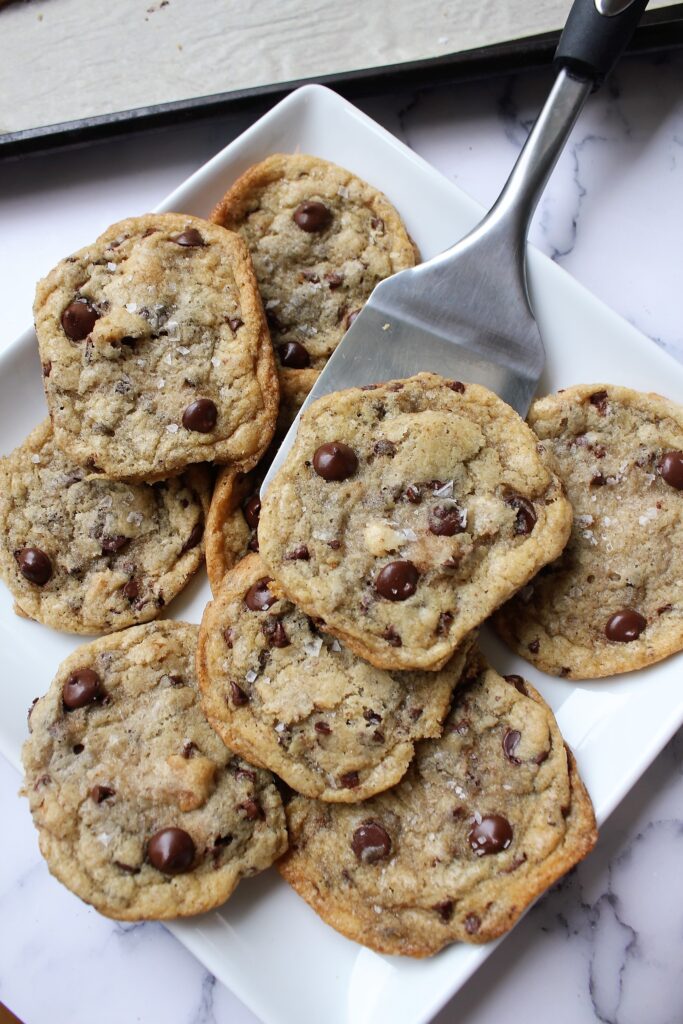 eggless chocolate chip cookies, thin and chewy, being served