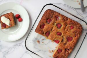 summer raspberry cake with one piece being served