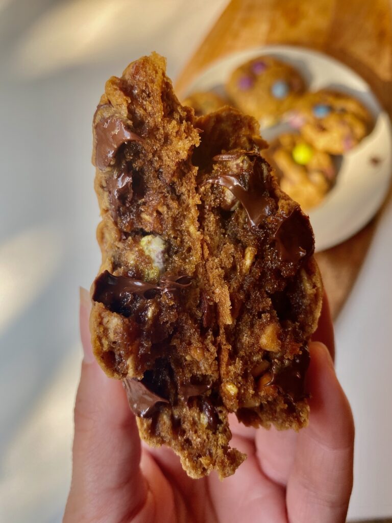 monster cookie, split in half where you can see the chocolate oozing out of the center