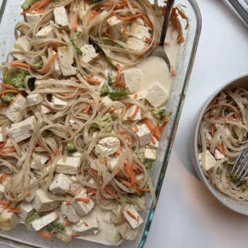 Steamed tofu noodle casserole with vegetables in creamy sauce